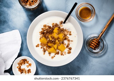 Homemade yogurt with granola and mango - Powered by Shutterstock