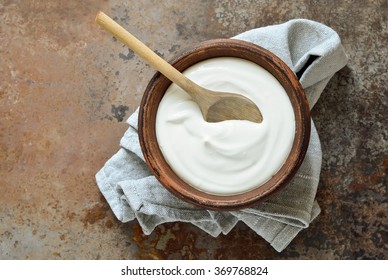 Homemade yogurt or sour cream in a rustic bowl
