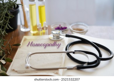 HOMEOPATHY essentials. open book with stethoscope, oils and natural remedies.