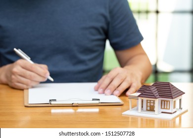 Homeowners selected refinancing of house and checking interest rates and monthly payments. Home mortgage loans from bank concept