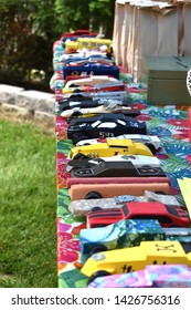 Homer Glen, IL - June 8, 2019: Pinewood Derby Cars That Will Compete In A Race Are Lined Up On Table At Backyard Party. Cars Carved By Hand In Like  A Bus, Hot Dog And Bun, Typical Race Car.