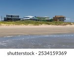 Homes along Jamaica Beach on a sunny day on the shores of Gulf Coast in Texas, USA