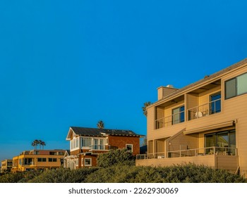 Homes with balconies and beach view at scenic Del Mar Southern Califronia. Seaside houses against clear blue sky on a quiet neighborhood and beautiful sunny day.