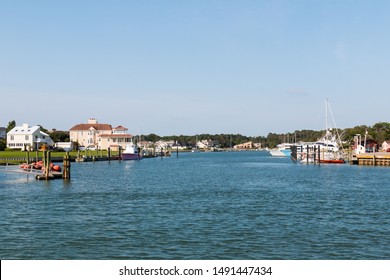 Homes And Boats On Lake Wesley At Rudee Inlet In Virginia Beach, Virginia.