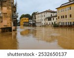 Homes and buildings are almost completely flooded due to a river overflowing during a flood caused by torrential rains brought on by climate change