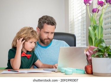 Homeschooling And Elearning. Back To School. Father And Child Use Computer At Home.