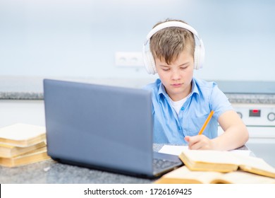 Homeschooling. Kids Learning From Home. Remote School, Online Education For High School Child During Quarantine. Pupil With Laptop And Tablet Computer. Teenager Boy Doing Homework.