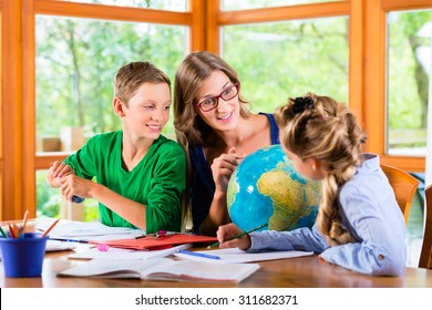 Homeschooling mother teaching kids private lessons in geography