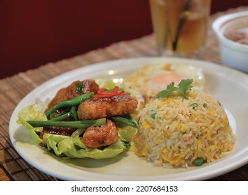 Hometown Black Pepper Fish Belly With Fried Rice Bento Served In A Dish Isolated On Table Side View