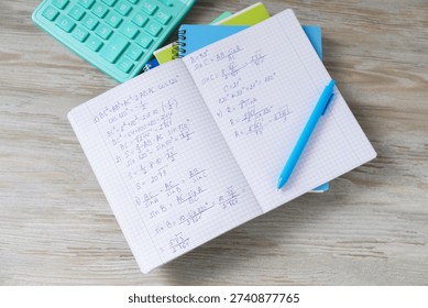 Homework. Notebook with math formulas and different stationery on light grey wooden table, flat lay - Powered by Shutterstock - Get 15% off with code: PIKWIZARD15