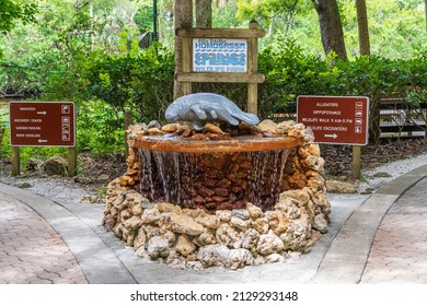 HOMOSASSA, FLORIDA, USA - MAY 17, 2021: Manatee statue and fountain near the entrance to Ellie Schiller Homosassa Springs Wildlife State Park