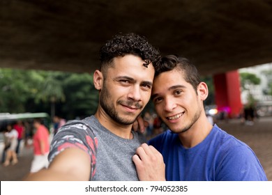 Homosexual Couple Talking A Selfie