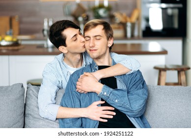Gay men kissing tenderly