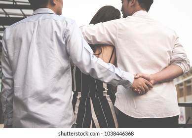 homosexual man hug woman while holding hands with secret lover. gay couple in love triangle. boyfriend cheating on girlfriend. same sex and homosexuality concept