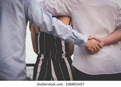 Homosexual Man Hug Woman While Holding Hands With Secret Lover. Gay Couple In Love Triangle. Boyfriend Cheating On Girlfriend. Same Sex And Homosexuality Concept