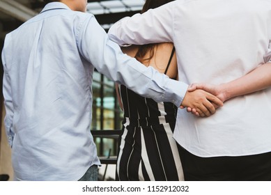 Homosexual Man Hug Woman While Holding Hands With Secret Lover. Gay Couple In Love Triangle. Boyfriend Cheating On Girlfriend. Same Sex And Homosexuality 