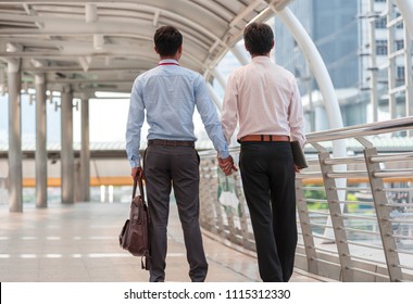 Homosexuality, Same-sex Marriage, Gay And Love Concept. Close Up Of Happy Male Gay Couple Or Friends On Business Clothes Hold Hands And Walking From Back