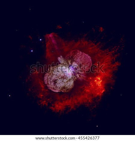 The Homunculus Nebula is a bipolar emission and reflection nebula surrounding the massive star system Eta Carinae. Retouched colored image. Elements of this image furnished by NASA. 