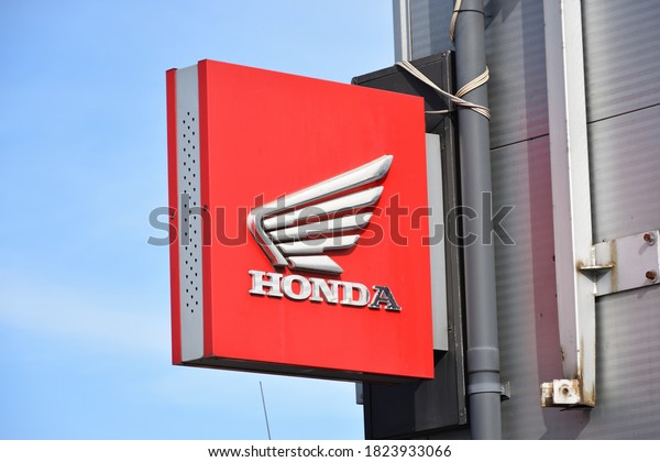 Honda sign,\
emblem, logo, symbol on the facade of Honda Motorcycle service.\
WARSAW, POLAND - SEPTEMBER 20,\
2020