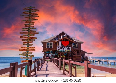 Roatán, Honduras »; January 2020: a wooden bar over the sea at West End Beach on the island of Roatan at sunset