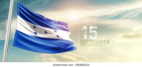 Honduras national flag waving in beautiful sunlight.