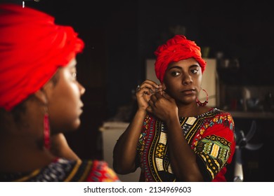 Honduras People, Native Young Caribbean Black Woman Holding Earring Front Mirror.