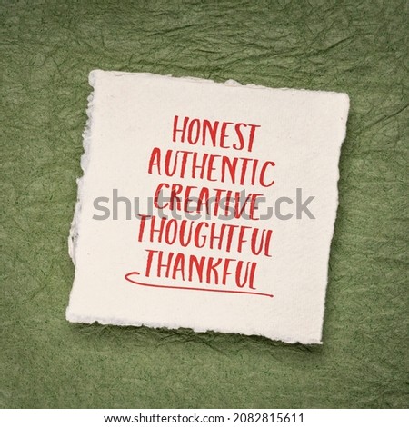 honest, authentic, creative, thoughtful and thankful - positive words or character traits - handwriting on a small square sheet of handmade paper, positive affitmations or personal development concept