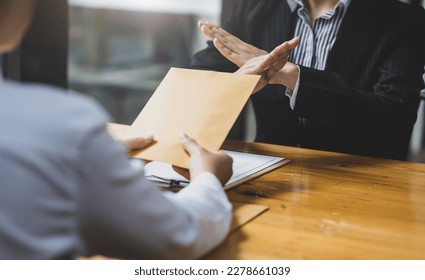 Honest officer refuses to take bribes from criminals. Businesswoman refusing to accept wages or bribes. - Shutterstock ID 2278661039