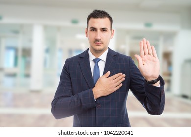 Honest Trustworthy Real Estate Agent Making Oath Swear Vow Gesture On New Apartment Building Lobby Background