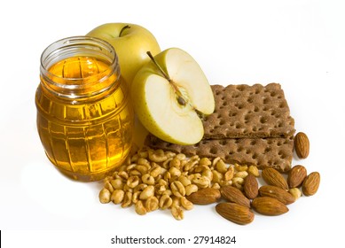 Honey, apples and nuts isolated on white background