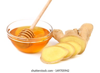 Honey In Bowl And A Slices Ginger Root