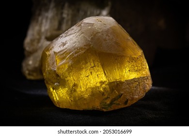 Honey Calcite Stone On A Black Background