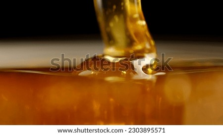 Honey close up. Pouring honey, macro
