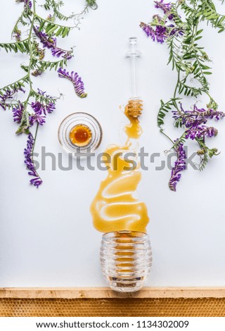 Similar – Image, Stock Photo Honey flows from glass and flowers