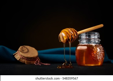 Honey Dipper
Finely balanced honey dipper dripping rich golden honey on a dark background - Powered by Shutterstock