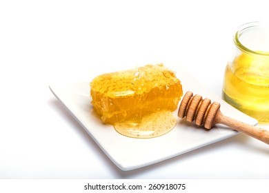honey dipper,  honeycomb and nohey on the white background