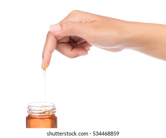 Honey Drip On Finger Isolated On White Background