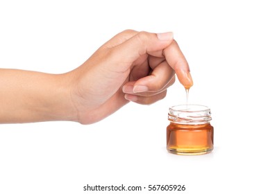 Honey Drip On Finger Isolated On White Background