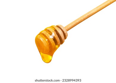 Honey dripping from honey dipper isolated on white background. Thick honey dipping from the wooden honey spoon. Healthy food and diet concept