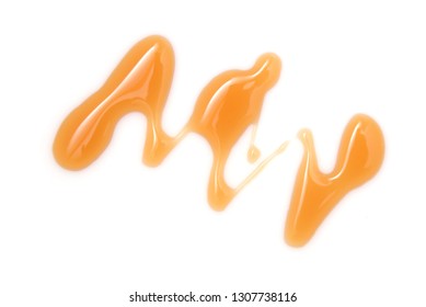 Honey drop isolated on white background. Pouring sweet honey swirl, closeup 