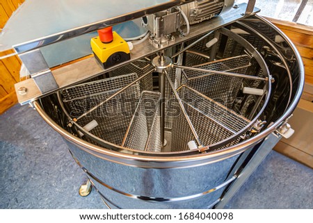 a honey extractor for spinning honeycombs