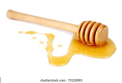 Honey Flowing Down From A Wooden Stick Isolated On White Background