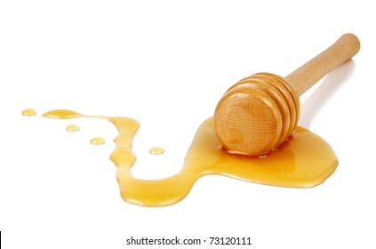 Honey Flowing Down From A Wooden Stick Isolated On White Background