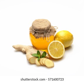 Honey, Ginger, Lemon And Spices On A White Background