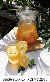 Honey lemon drink or Lemon tea drink in transparent glass and jar. 