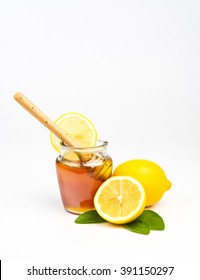 Honey With Lemon On White Background