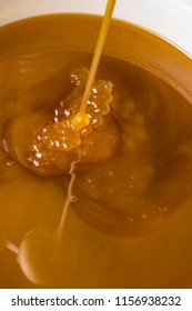 Honey Liquid Background Macro Closeup. Helth Food