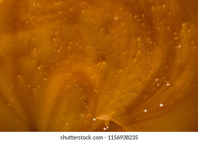 Honey Liquid Background Macro Closeup. Helth Food