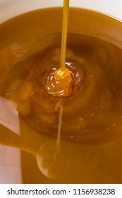 Honey Liquid Background Macro Closeup. Helth Food