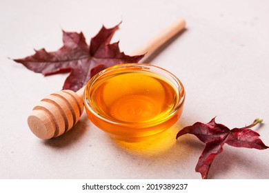 Honey or maple syrup in a bowl. - Shutterstock ID 2019389237